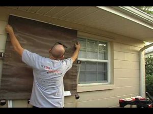 Storm Smart employee demonstrating how to install an Easy Screen