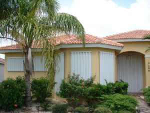 Aluminum accordion shutters on a Florida home