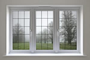 Close up of window with a view of the outside forested area