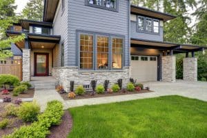 Two story home with large windows